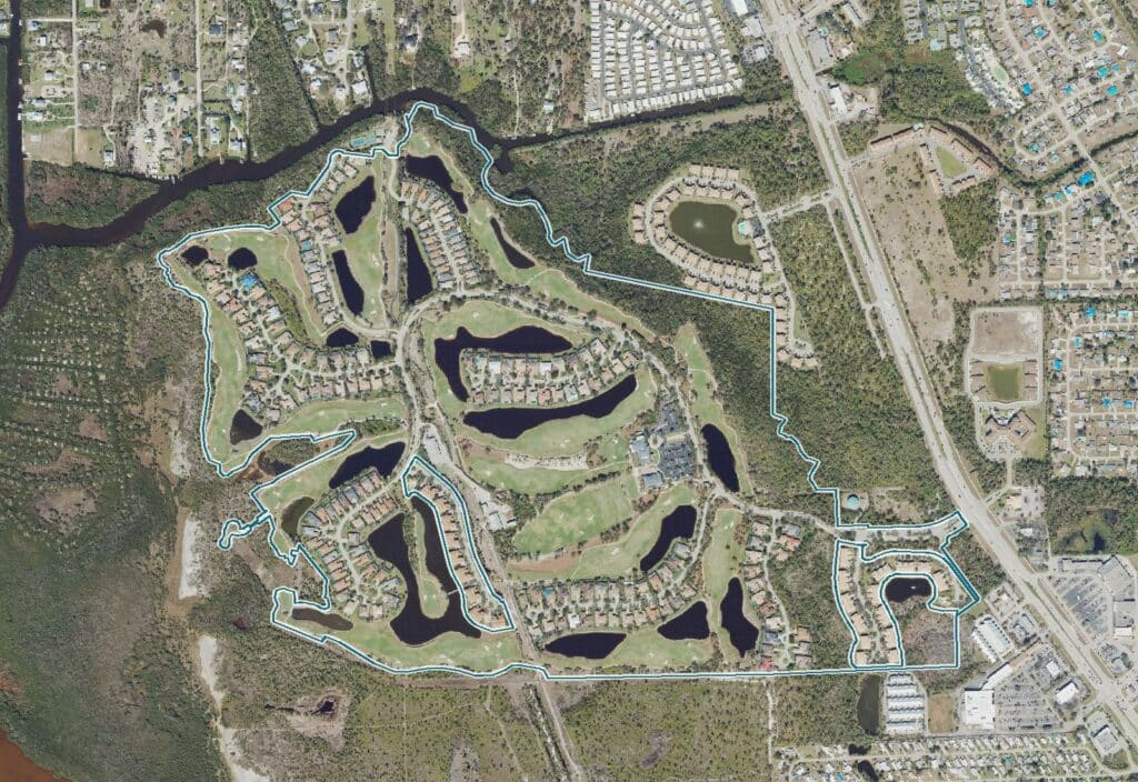 Aerial view of Shadow Wood Preserve, a gated golf community in south Fort Myers, Florida, built around the Shadow Wood Country Club Preserve course, with the community boundary outlined