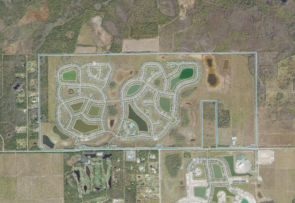 Aerial view of The Place at Corkscrew, Estero, FL, with the community boundary outlined
